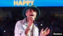 Pharrell Williams performs his hit song "Happy" at the Walmart annual shareholders meeting in Fayetteville, Arkansas, June 6, 2014.