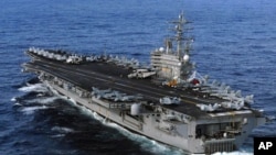 FILE - USS Ronald Reagan is directed to Japan following a 8.9 earthquake and tsunami to render humanitarian assistance and disaster relief, March 12, 2011.