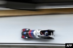 Elana Meyers Taylor of the U.S. competes in the women's monobob during the IBSF Bobsleigh International Sanctioned Race, part of a 2022 Beijing Winter Olympic Games test event, at the Yanqing National Sliding Center in Beijing, Oct. 25, 2021.