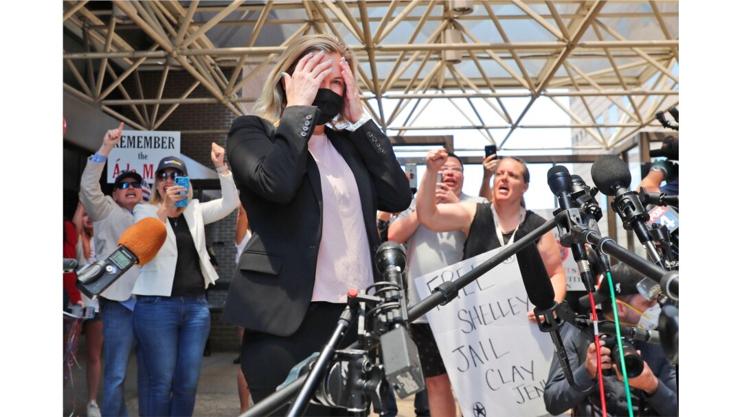 Salon owner Shelley Luther reacts as supporters chant for her after she was released from jail in Dallas, May 7, 202 for refusing to keep her business closed amid concerns of the spread of COVID-19.