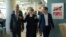 German Interior Minister Thomas de Maiziere; Eva- Maria Kirschsieper, Facebook head of public policy; and Martin Ott, Facebook managing director central Europe, from left, walk during a visit at the Facebook office in Berlin, Germany, Aug. 29, 2016. 