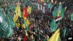 Palestinians celebrate the Israel-Hamas cease-fire in Gaza City, November 22, 2012.