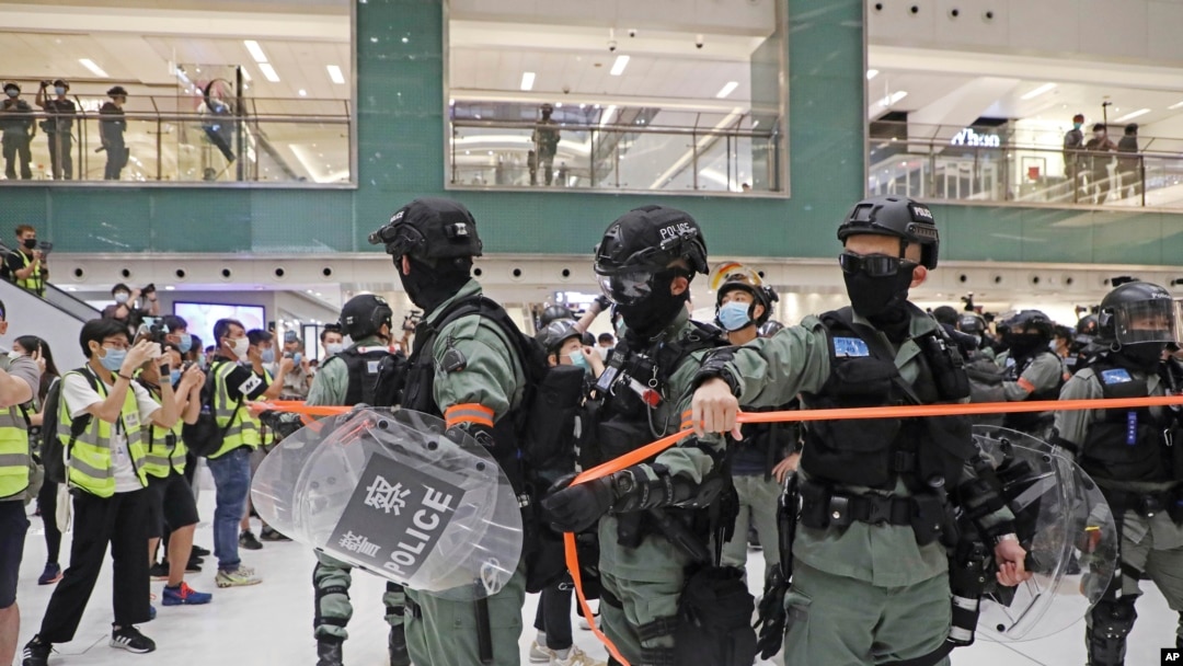 Riot police enter the shopping mall to disperse the protesters during the Labor Day in Hong Kong, May 1, 2020.