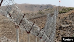 A view of the border fence outside the Kitton outpost on the border with Afghanistan in North Waziristan, Pakistan, Oct. 18, 2017. 