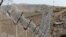 A view of the border fence outside the Kitton outpost on the border with Afghanistan in North Waziristan, Pakistan, Oct. 18, 2017. 