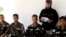 Man reads a statement as four abducted Filipino UN peacekeepers are seen in Daraa, Syria, May 9, 2013.a