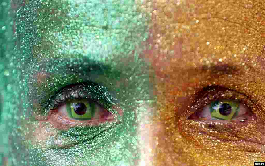 A demonstrator with the design of the national flag in her eyes attends a protest against Brazil&#39;s President Dilma Rousseff, part of nationwide protests calling for her impeachment, at Paulista Avenue in Sao Paulo&#39;s financial center, Aug. 16, 2015.
