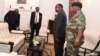 FILE: Zimbabwe's President Robert Mugabe meets with Father Fidelis Mukonori, Secretary to the Cabinet Dr Misheck Sibanda and Defense Forces Commander General Constantino Chiwenga at State House in Harare, Nov. 19, 2017.