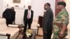 FILE - Zimbabwe's President Robert Mugabe meets with Father Fidelis Mukonori, Secretary to the Cabinet Dr Misheck Sibanda and Defense Forces Commander General Constantino Chiwenga at State House in Harare, Nov. 19, 2017. 