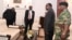 FILE - Zimbabwe's President Robert Mugabe meets with Father Fidelis Mukonori, Secretary to the Cabinet Dr Misheck Sibanda and Defense Forces Commander General Constantino Chiwenga at State House in Harare, Nov. 19, 2017. 