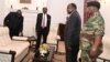 FILE - Zimbabwe's President Robert Mugabe meets with Father Fidelis Mukonori, Secretary to the Cabinet Dr Misheck Sibanda and Defense Forces Commander General Constantino Chiwenga at State House in Harare, Nov. 19, 2017. 