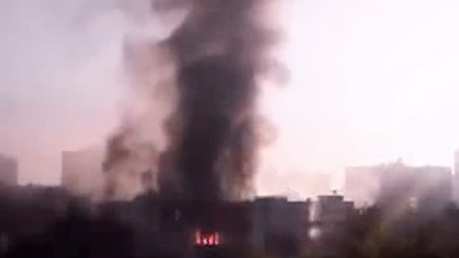 In this image taken from video obtained from the Syria 2011 Archives, which has been authenticated based on its contents and other AP reporting, black smoke rises from Syria's army command headquarters in Damascus, Syria, on Sept. 26, 2012. 