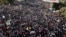 Thousands of protesters take to the streets to renew their demand for a civilian government in the Sudanese capital Khartoum, Nov. 25, 2021. 