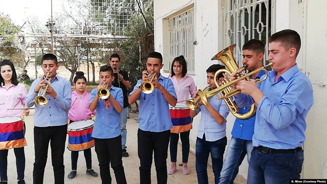 Students practice on instruments donated in Qamishli, Syria, July 2018.