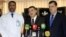 Dr. Essam Namiq, center, deputy Health Minister speaks as Dr. Hani Moussa, left, head of the Iraqi medical team supervising treatment of Iraqi president Jalal Talabani, and Iraq Presidential spokesman listen, Dec. 19, 2012.