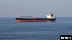 FILE - Oil tankers pass through the Strait of Hormuz, Dec. 21, 2018.