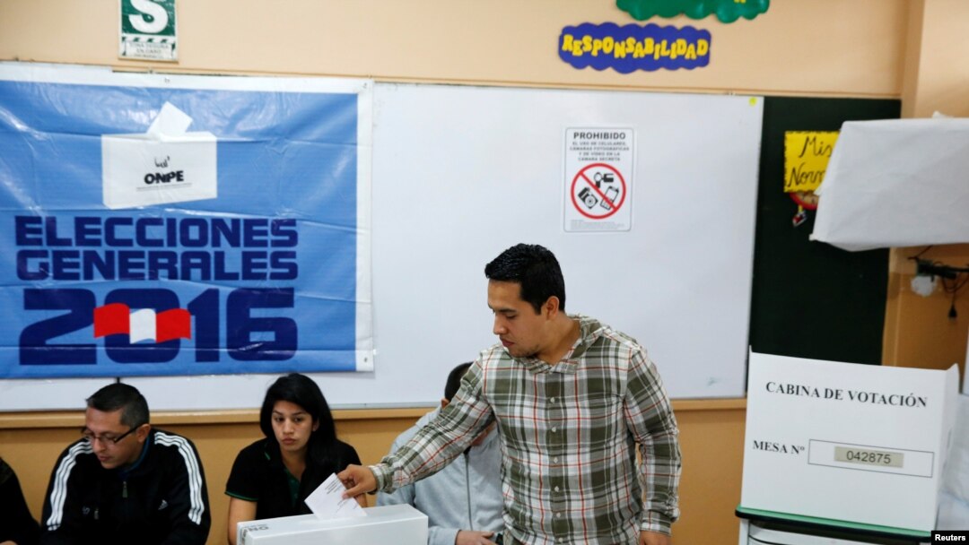 A man casts his ballot in Peru's presidential election at a voting station in Lima, Peru, June 5, 2016. 