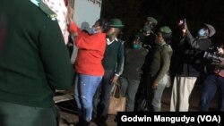 FILE: Joanna Mamombe boarding a prison truck in Harare ...