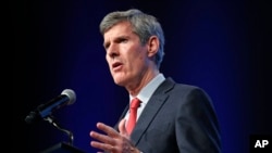FILE - Iowa Democratic gubernatorial candidate Fred Hubbell speaks during the Iowa Democratic Party's annual Fall Gala in Des Moines, Iowa, Oct. 6, 2018. 