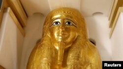 The gold coffin of Nedjemankh is displayed during a news conference to announce its return to the people of Egypt, in New York City, Sept. 25, 2019.