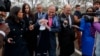 White House chief economic adviser Larry Kudlow calls for a "timeout" as he talks to reporters outside the White House, April 6, 2018, in Washington. 