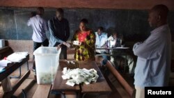 Poll workers count ballots in Bamako, Aug. 11, 2013.