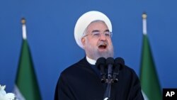 Iran's President Hassan Rouhani speaks at a military parade marking National Army Day in front of the mausoleum of the late revolutionary founder Ayatollah Khomeini, just outside Tehran, April 17, 2016.