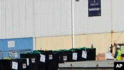 FILE — Food aid, left on the pallets, from the U.S. charity World Central Kitchen and the United Arab Emirates is seen being loaded aboard a second vessel preparing to depart for Gaza, at Larnaca port, Cyprus, on Friday, March 15, 2024.