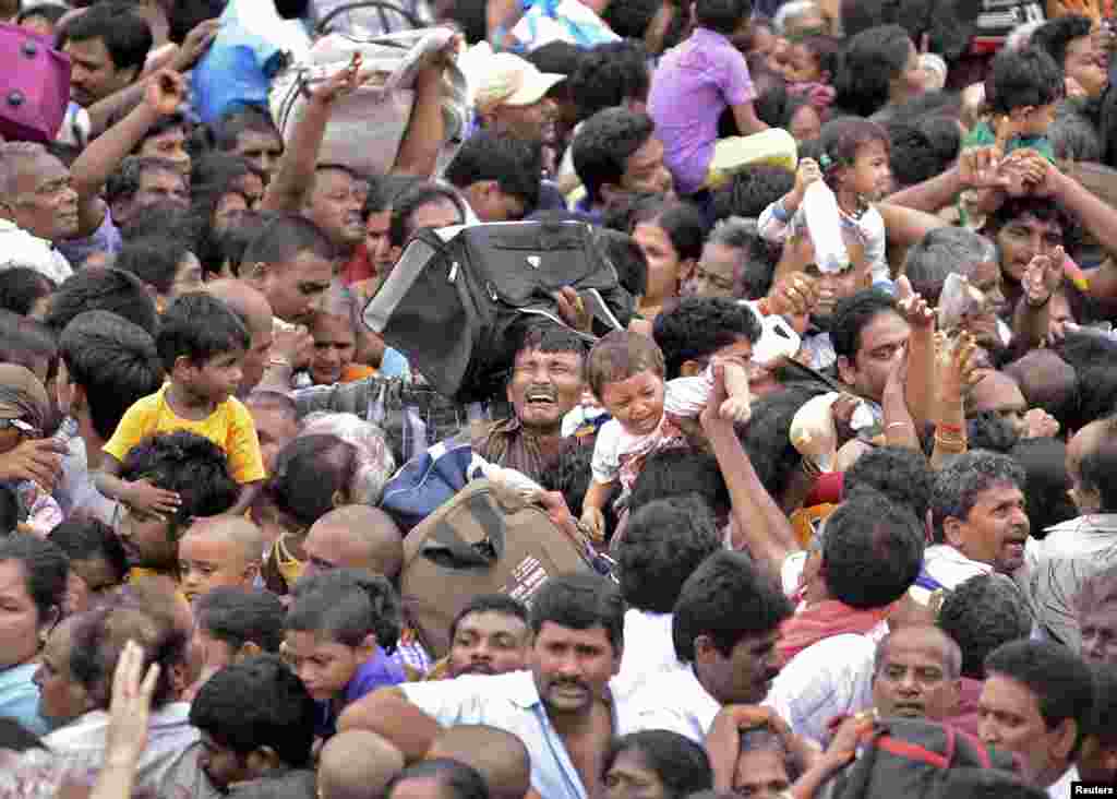 Devotees crowd together at the Maha Pushkaralu, a Hindu festival, on the banks of river Godavari at Rajahmundry in Andhra Pradesh, India. Twenty-seven people were killed and 40 injured in a stampede, police said.