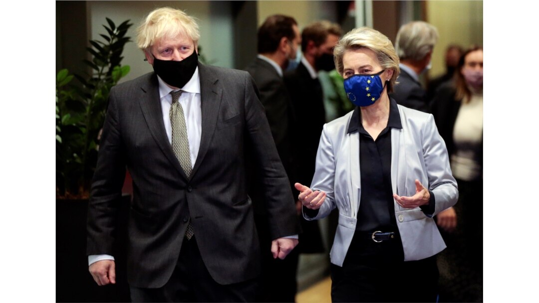 FILE - European Commission President Ursula von der Leyen welcomes British Prime Minister Boris Johnson in Brussels, Belgium, Dec. 9, 2020.
