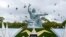 Doves surround the Peace Statue in Nagasaki's Peace Park in a ceremony commemorating the Japanese city's 1945 atomic bombing in photo taken by Kyodo Aug. 9, 2014.