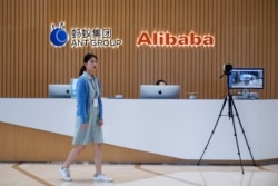 FILE - A logo of Ant Group is pictured at the headquarters of the company, an affiliate of Alibaba, in Hangzhou, Zhejiang province, China, Oct. 29, 2020.