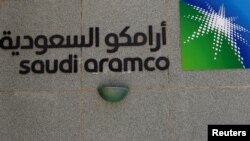 FILE - The logo of Saudi Aramco is seen at Aramco headquarters in Dhahran, Saudi Arabia, May 23, 2018