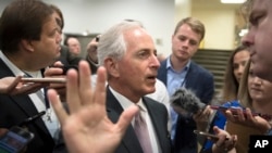 Senate Foreign Relations Committee Chairman Bob Corker, R-Tenn., speaks with reporters as he and other lawmakers arrive for a vote, at the Capitol in Washington, Oct. 17, 2017.