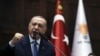 Presiden Turki Recep Tayyip Erdogan berpidato di hadapan para legislator partai berkuasa di Parlemen, di Ankara, Rabu, 16 Oktober 2019. (Foto: AP)
