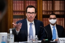 FILE - Treasury Secretary Steven Mnuchin speaks on Capitol Hill in Washington, June 10, 2020.