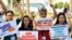 Activists hold placards and shout slogans during a protest at the United Nations climate summit COP28 in Dubai, United Arab Emirates, on Dec. 6, 2023.