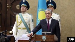 Kazakhstan's Senate chairman Kassym-Jomart Tokayev takes the oath as Kazakh interim president during a ceremony in Astana, March 20, 2019. 