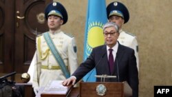 Kazakhstan's Senate chairman Kassym-Jomart Tokayev takes the oath as Kazakh interim president during a ceremony in Astana, March 20, 2019. 