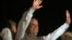 Former Prime Minister and leader of the Pakistan Muslim League-N party Nawaz Sharif waves to his supporters at a party office in Lahore, May 11, 2013. 