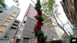 Christmas decorations remain on a lamp post June 25, 2021, on 2nd Avenue North in Nashville, Tenn., where a suicide bombing took place Dec. 25, 2020.