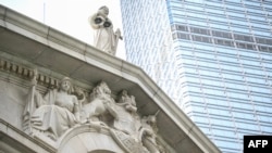 FILE - The scales of justice are seen on top of the Court of Final Appeal in Hong Kong on June 24, 2024. A British justice has become the fifth foreign judge to step down from the Court of Final Appeal this year. 