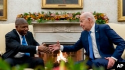 FILE — President Joe Biden meets with Angola's President Joao Manuel Goncalves Lourenco in the Oval office of the White House, Thursday, November 30, 2023, in Washington.