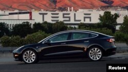 The first production model of Tesla Model 3 from the assembly line in Fremont, California. The handout photo from Tesla Motors obtained by Reuters, July 10, 2017.