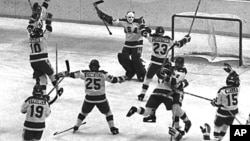 Members of the 1980 U.S. Olympic hockey team celebrate after their upset victory over the heavily favored Soviet team by 4-3 score in the Winter Olympics in Lake Placid, N.Y., on Feb. 22, 1980.