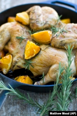 This photo shows a spatchcocked chicken. To spatchcock a chicken, or any bird, you cut along the center backbone, starting at the neck and right through to the rump, Sept. 28, 2011, Concord, New Hampshire. (AP Photo/Matthew Mead)