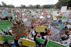Thousands of protesters, many of them school students, gather in Sydney, Sept. 20, 2019, calling for action against climate change. Australia's acting Prime Minister Michael McCormack has described ongoing climate rallies as "just a disruption."