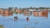 People row kayaks on flooded streets in the city of Bahia Blanca, in the province of Buenos Aires, Argentina, March 9, 2025. 