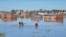 People row kayaks on flooded streets in the city of Bahia Blanca, in the province of Buenos Aires, Argentina, March 9, 2025. 