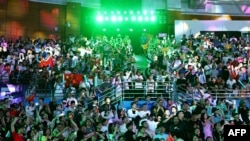 Spectators attend the award ceremony for badminton men’s team match during the 2022 Asian Games in Hangzhou in China's eastern Zhejiang province on October 1, 2023. South Korea won the women’s team singles in badminton Sunday at the Asian Games, defeating China 3-0. 